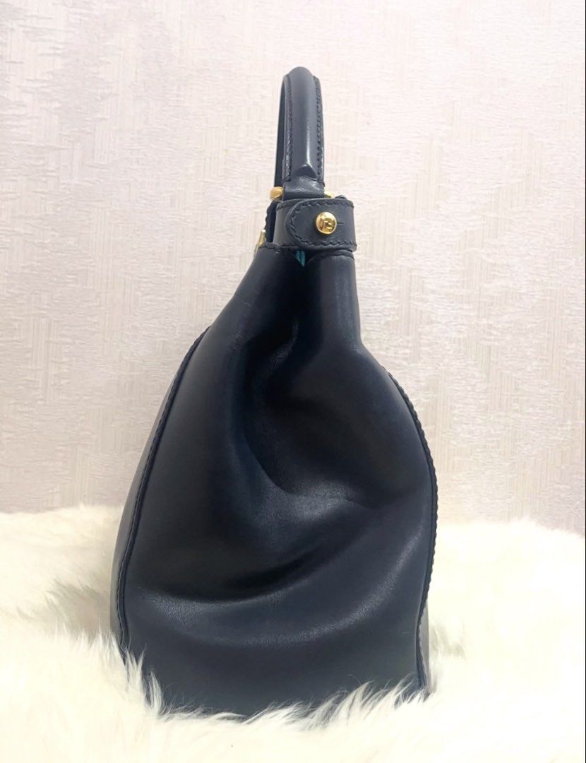 Fendi Peekaboo Medium Leather Bag (Category: Luxury Bags & Wallets) located in Makati City. Submitted by dgcurated09 (Listing ID 1469568211, Image 2). Description: - Brand: Fendi - Model: Peekaboo - Color: Dark Navy exterior with a bold turquoise interior lining - Hardware: Gold-tone with secure turn-lock closures on both sides - Material: Premium leather - Strap: Single top handle plus an adjustable and removable shoulder strap - Details: Protec