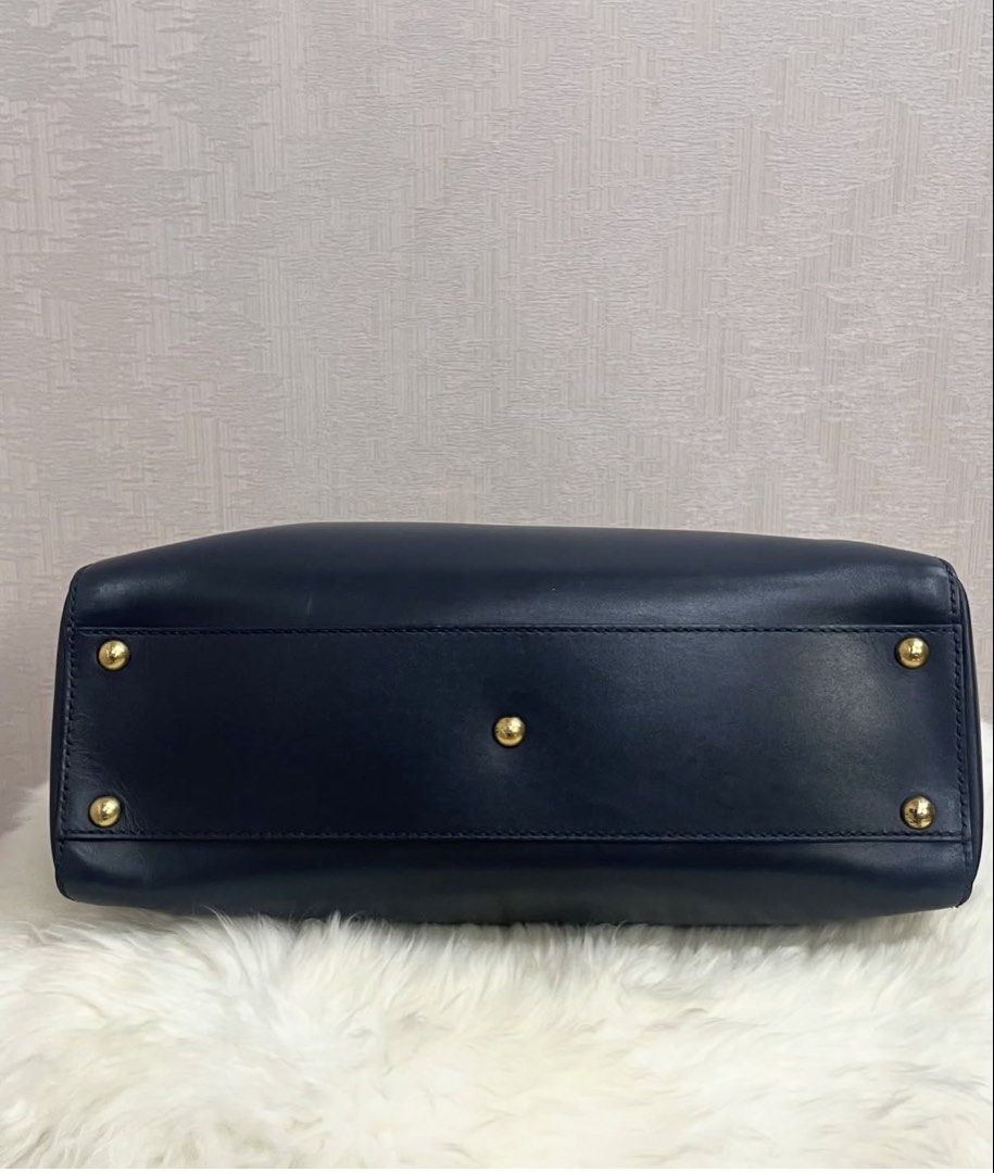 Fendi Peekaboo Medium Leather Bag (Category: Luxury Bags & Wallets) located in Makati City. Submitted by dgcurated09 (Listing ID 1469568211, Image 3). Description: - Brand: Fendi - Model: Peekaboo - Color: Dark Navy exterior with a bold turquoise interior lining - Hardware: Gold-tone with secure turn-lock closures on both sides - Material: Premium leather - Strap: Single top handle plus an adjustable and removable shoulder strap - Details: Protec
