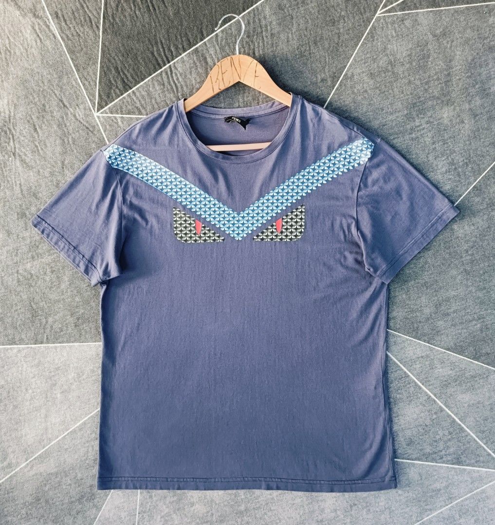 Fendi Shirt (Authentic) (Category: Tshirts & Polo Shirts ) located in Cebu City. Submitted by renzecamingay (Listing ID 1469399483, Image 2). Description: Fendi Excellent Condition Large fit Width 21 Length 27 (Issue tear main tag) 1500 Plus ship Only Thank you and GOD bless ☺️.