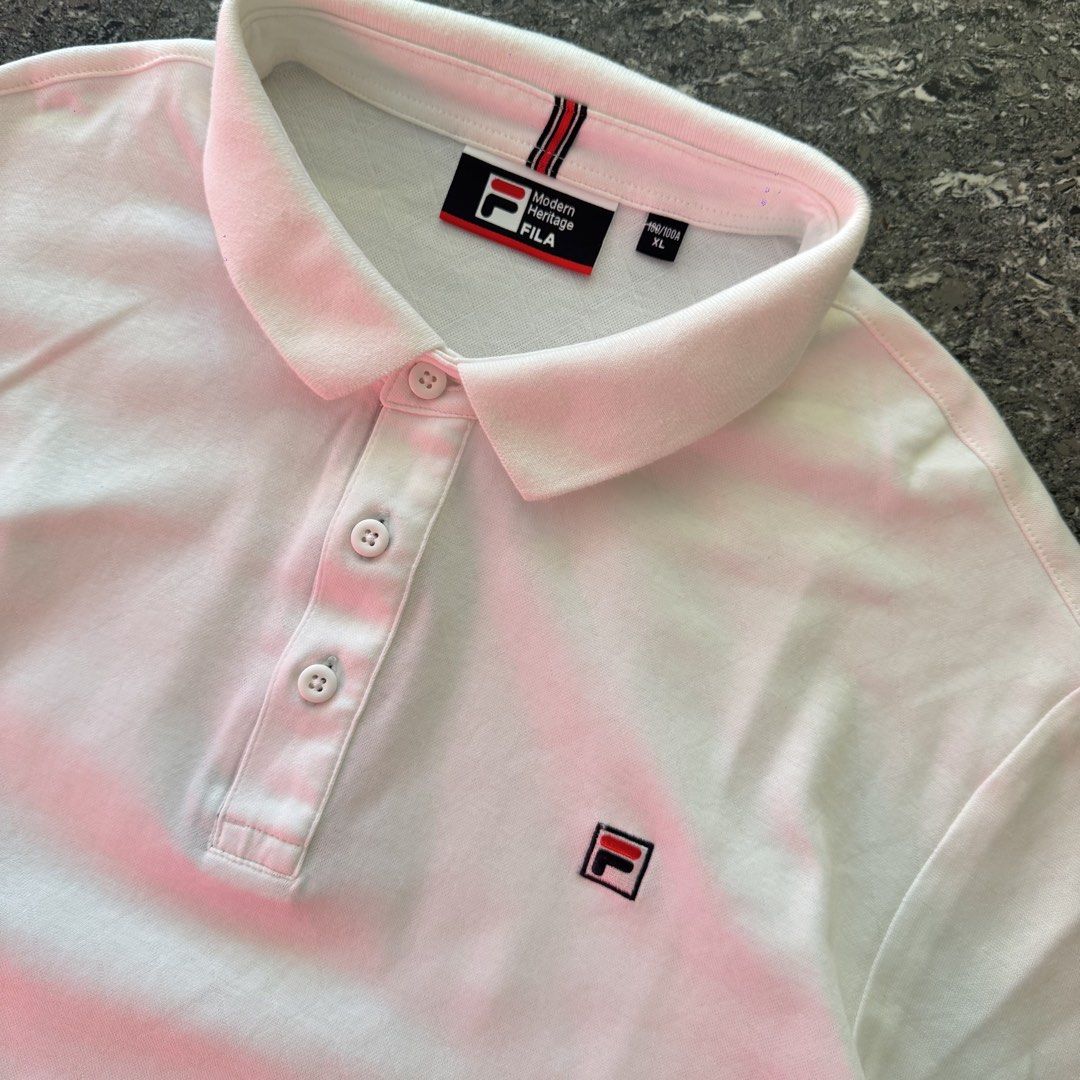 Fila Polo Shirt (Category: Tshirts & Polo Shirts ) located in Bulacan. Submitted by b4mzz (Listing ID 1469466663, Image 3). Description: Fila Classic White Polo 👕 Clean white Fila polo with a classic minimalist design. Perfect for everyday and smart casual fits. 📏 Width: 22” | Length: 28” ✨ Condition: Excellent ✅ No issue 💬 Open for reasonable offers!.