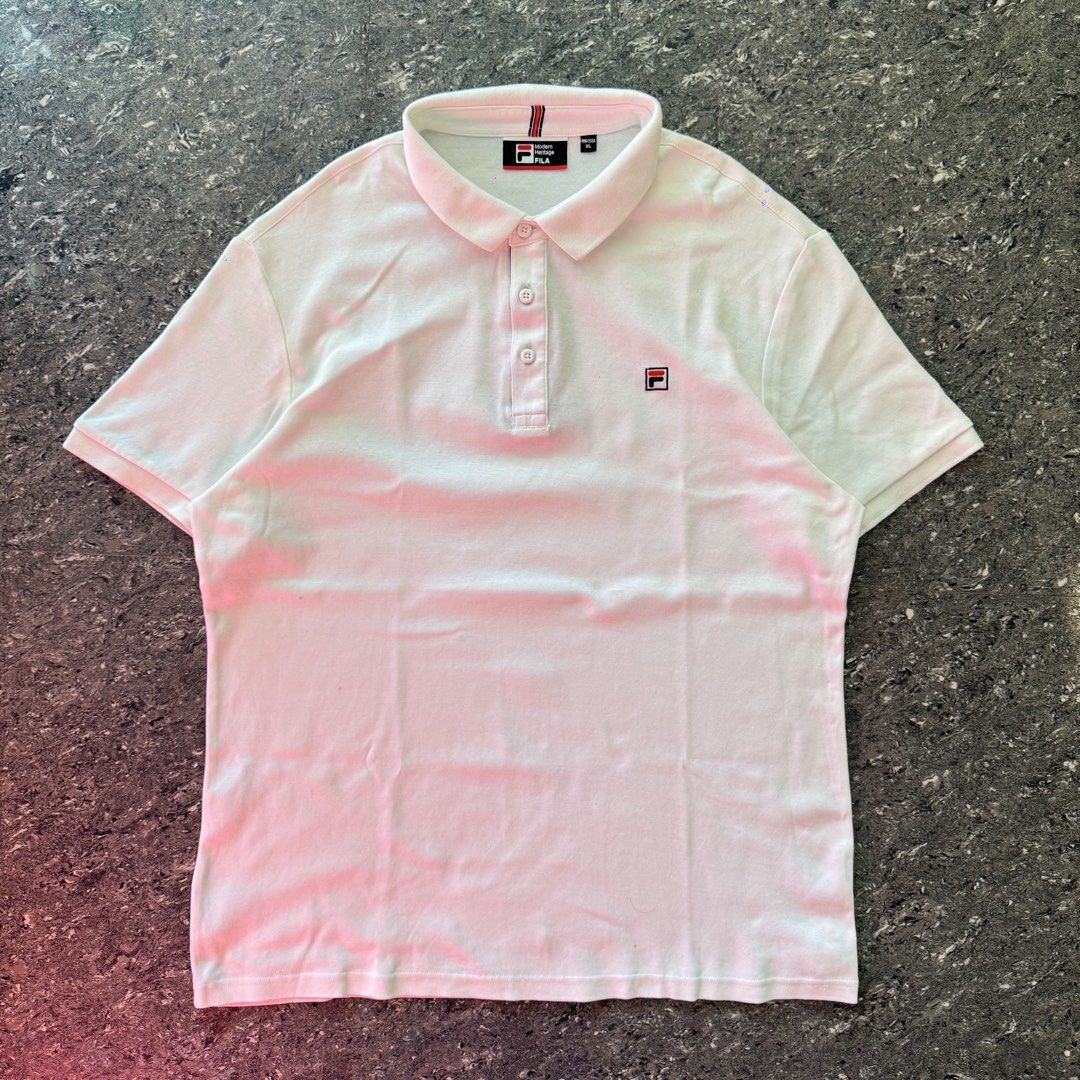 Fila Polo Shirt (Category: Tshirts & Polo Shirts ) located in Bulacan. Submitted by b4mzz (Listing ID 1469466663, Image 2). Description: Fila Classic White Polo 👕 Clean white Fila polo with a classic minimalist design. Perfect for everyday and smart casual fits. 📏 Width: 22” | Length: 28” ✨ Condition: Excellent ✅ No issue 💬 Open for reasonable offers!.