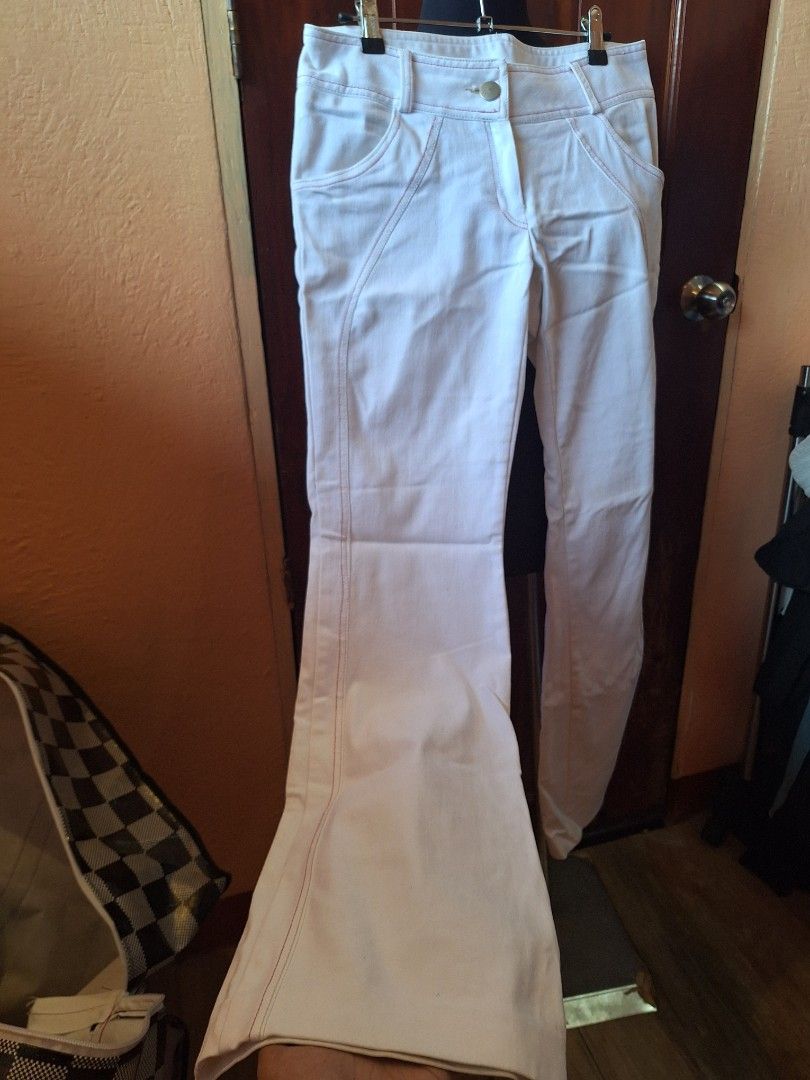 FLARE BOTTOMS White denim jeans size M (Category: Jeans) located in Balamban. Submitted by ubethan (Listing ID 1469459868, Image 2). Description: - Item: White denim pants with stylish contrast stitching - Size: Medium (tag attached inside) - Material: 60% cotton, 30% polyester blend - Shipping: Ships via J&T Express (Buyer shoulders shipping fee) - PM for inquiries and fast transactions!.