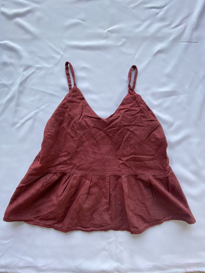 Floral Print Cami and Solid Rust Tank Top Bundle (Category: Sleeveless) located in Cauayan City . Submitted by alt_olshop4 (Listing ID 1469539040, Image 3). Description: - Bundle includes 2 cute and lightweight casual camisoles - Piece 1: Navy blue base with tiny red/white flowers and a flattering smocked waist - Piece 2: Solid rust orange shade featuring thin straps and a slightly flared hem - Easy to mix and match for effortless everyday stylin