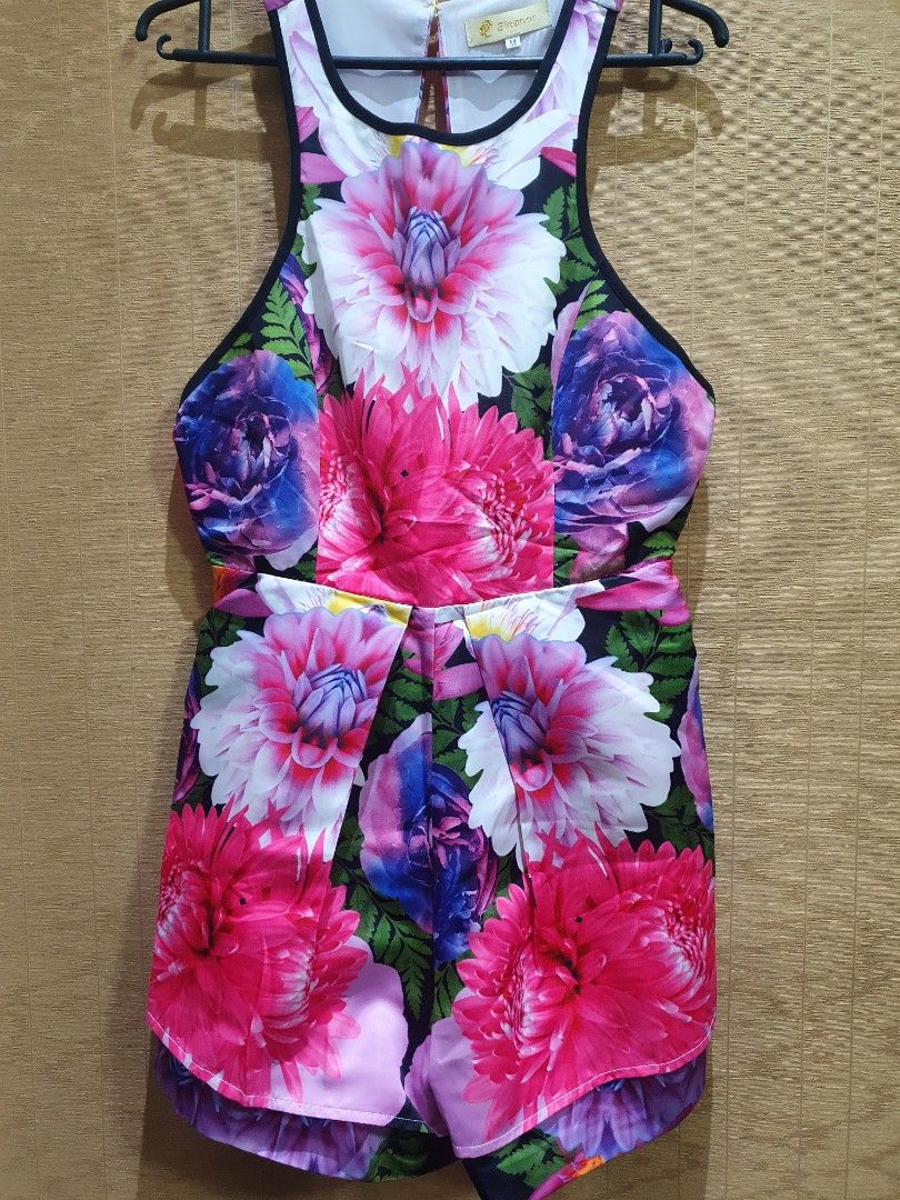 Floral Print Sleeveless Romper Size M (Category: Rompers) located in San Juan City. Submitted by miles567 (Listing ID 1469509379, Image 1). Description: Brand new & imported high quality - Style: Sleeveless halter romper with a chic cutout back and zipper closure - Design: Vibrant pink and blue dahlia floral print with contrasting black trim - Size: Medium - Material: Lightweight and breathable fabric, ideal for warm weather - Condition: Excellen