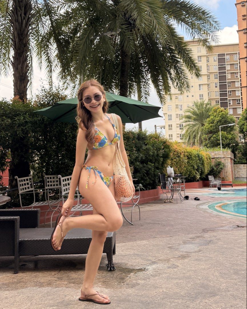Floral Print Two-Piece Bikini Set (Category: Bikinis & Swimsuits) located in Manila. Submitted by plsbuymyclotheshehe (Listing ID 1469514391, Image 2). Description: - Style: Colorful floral print bikini set - Top: Adjustable triangle top with ties - Bottoms: Adjustable side-tie bottoms for a custom fit - Features: Super comfy, fun, and vibrant pattern ready for your next beach trip.