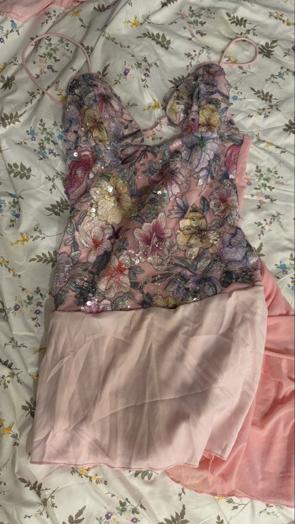 FLORAL SEQUENCE MINI DRESS (Category: Dresses) located in Manila. Submitted by gentlecat.878c83 (Listing ID 1469418821, Image 2). Description: - Brand: Soleia - Style: Vibrant vacation dress in pink mesh with colorful floral embroidery and sparkling sequins - Details: Adjustable spaghetti straps with front clasp, ruched wrap skirt overlay with a mini hemline - Condition: Worn once for a quick photo shoot, like-new - Environment: From a smoke-free