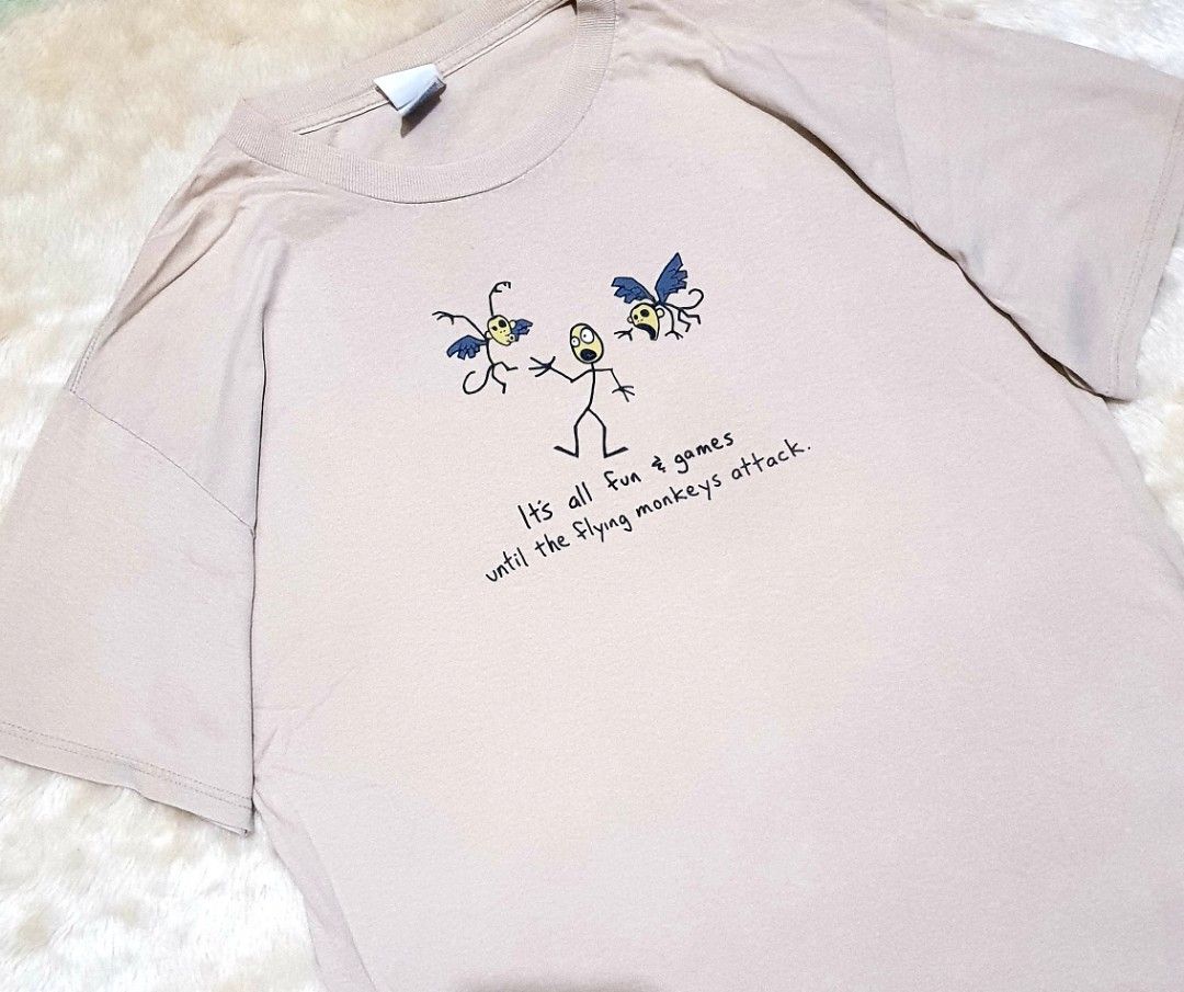Flying Monkeys (Category: Tshirts & Polo Shirts ) located in Taguig. Submitted by wethrifting2021 (Listing ID 1469510940, Image 2). Description: Item: It's all fun & games until the flying monkeys attack🔥 Size: Tennesse River Hardtag (L) Width: 21 Length: 29 Condition: Excellent Issue: None SWIPE MORE DETAILS. DM to purchase 📩.