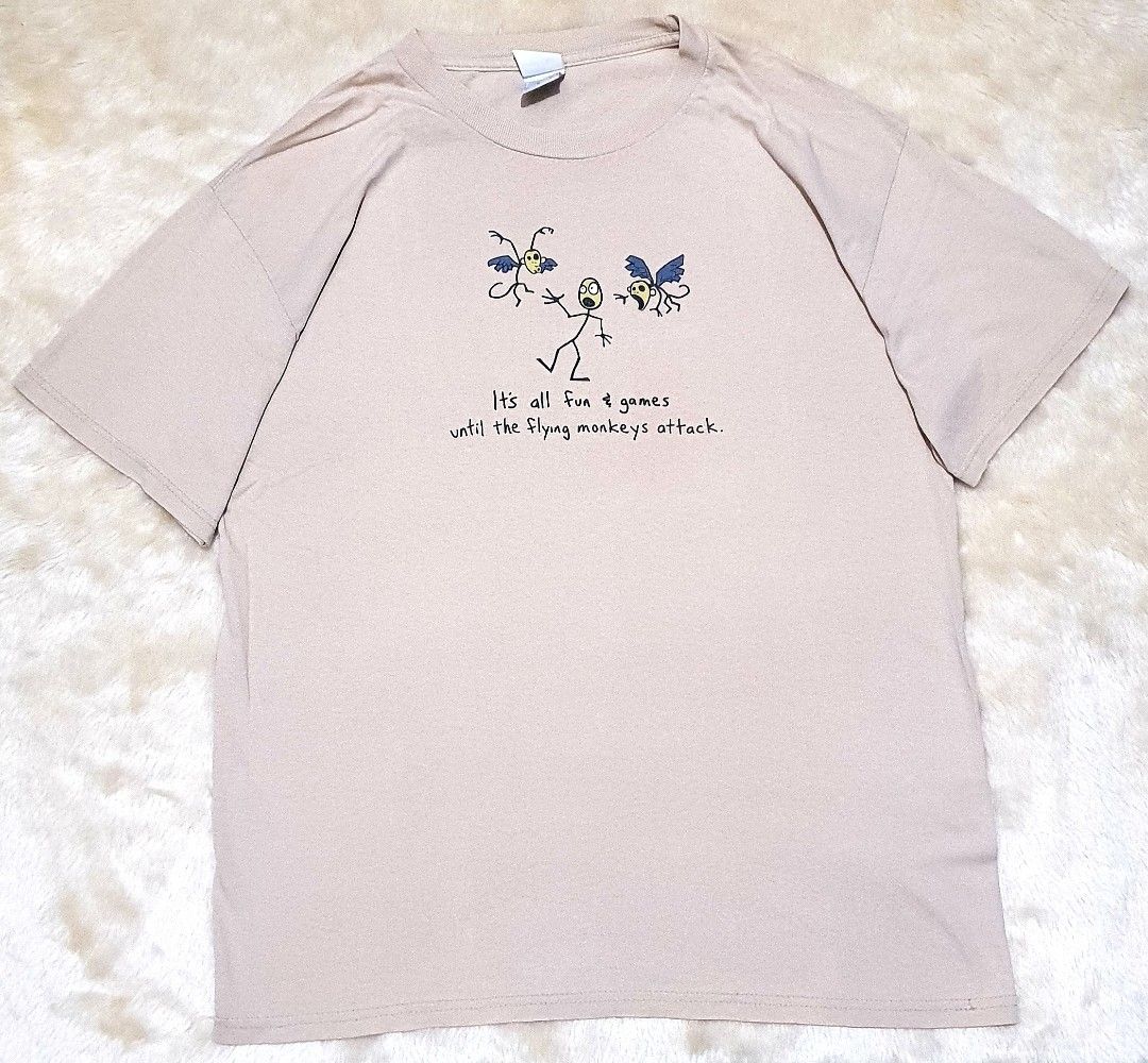 Flying Monkeys (Category: Tshirts & Polo Shirts ) located in Taguig. Submitted by wethrifting2021 (Listing ID 1469510940, Image 1). Description: Item: It's all fun & games until the flying monkeys attack🔥 Size: Tennesse River Hardtag (L) Width: 21 Length: 29 Condition: Excellent Issue: None SWIPE MORE DETAILS. DM to purchase 📩.