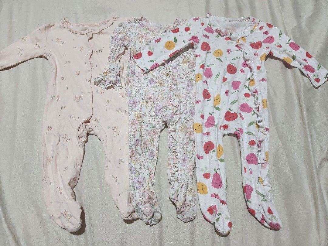 Footed Frogsuits Bundle 3 Pieces (Category: Babies & Kids Fashion) located in Caloocan City. Submitted by jonaliemae09842 (Listing ID 1469565424, Image 1). Description: - Set of 3 long sleeve footed rompers for baby girls - Includes 3 cute designs: plain light pink floral, vintage floral with ruffles, and apple/pear fruit pattern - Easy snap-front closure for quick diaper changes - Made with soft, comfortable cotton perfect for sleep or daily wea