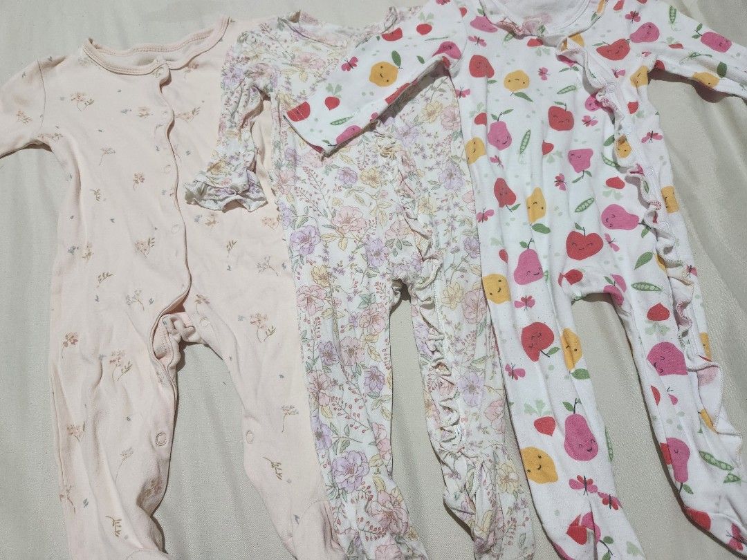 Footed Frogsuits Bundle 3 Pieces (Category: Babies & Kids Fashion) located in Caloocan City. Submitted by jonaliemae09842 (Listing ID 1469565424, Image 2). Description: - Set of 3 long sleeve footed rompers for baby girls - Includes 3 cute designs: plain light pink floral, vintage floral with ruffles, and apple/pear fruit pattern - Easy snap-front closure for quick diaper changes - Made with soft, comfortable cotton perfect for sleep or daily wea