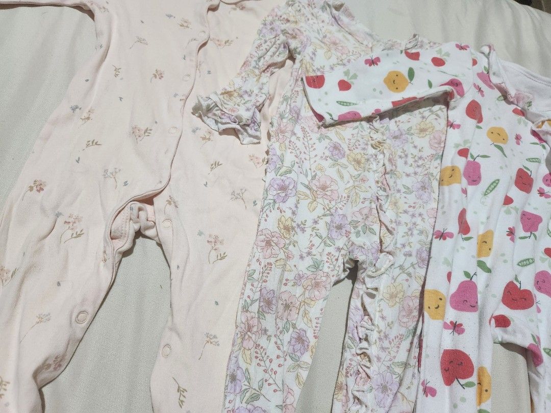 Footed Frogsuits Bundle 3 Pieces (Category: Babies & Kids Fashion) located in Caloocan City. Submitted by jonaliemae09842 (Listing ID 1469565424, Image 3). Description: - Set of 3 long sleeve footed rompers for baby girls - Includes 3 cute designs: plain light pink floral, vintage floral with ruffles, and apple/pear fruit pattern - Easy snap-front closure for quick diaper changes - Made with soft, comfortable cotton perfect for sleep or daily wea