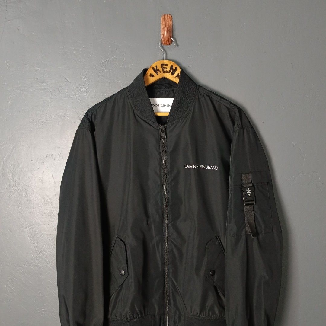 For Men - Calvin Klein - Bomber Jacket (Category: Coats, Jackets and Outerwear) located in Bacolod City. Submitted by drop.ph (Listing ID 1469471792, Image 3). Description: Calvin Klein - Bomber Jacket Authentic *Size M fits L - 24x26 *Excellent *No Flaws *Price: 2,000php *Add SF if outside Bacolod City .