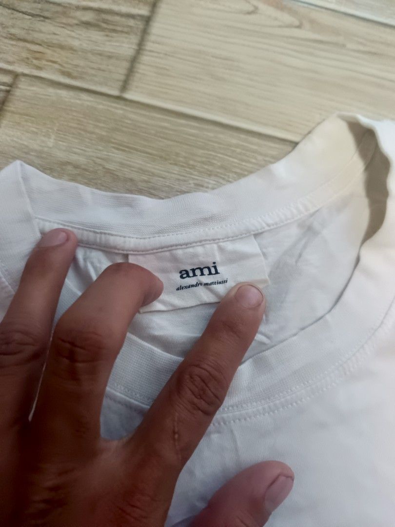 For sale (Category: Activewear) located in Koronadal. Submitted by 9509thrift (Listing ID 1469438362, Image 2). Description: AMI WHITE TEE GOOD CONDITION NO HIDDEN ISSUE NEED WASH LANG PO CAN DO J&T 680 +SF.