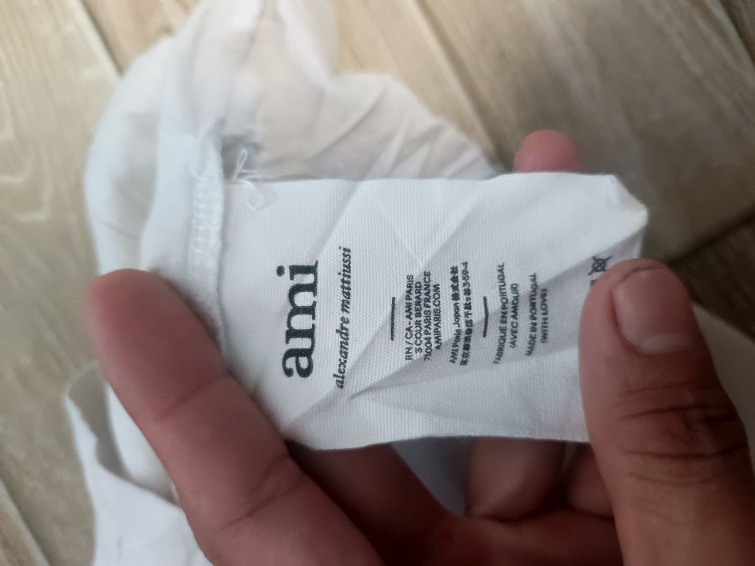 For sale (Category: Activewear) located in Koronadal. Submitted by 9509thrift (Listing ID 1469438362, Image 3). Description: AMI WHITE TEE GOOD CONDITION NO HIDDEN ISSUE NEED WASH LANG PO CAN DO J&T 680 +SF.