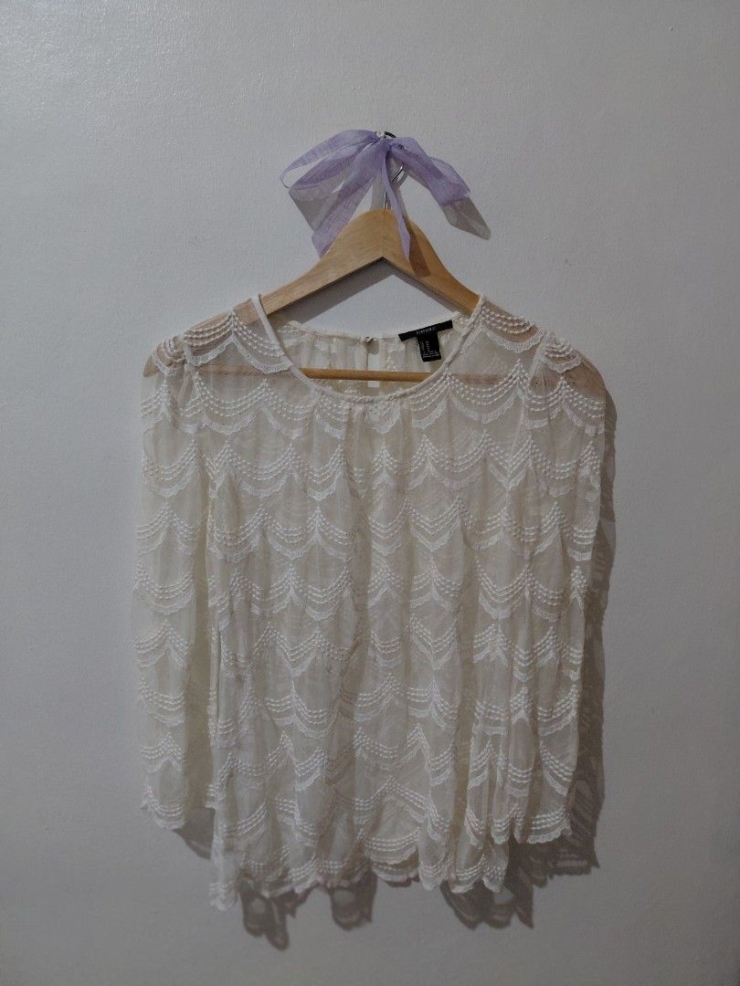 Forever 21 Lace Long Sleeves Top (Category: Blouses) located in Tarlac. Submitted by wornwardrobe (Listing ID 1469444642, Image 1). Description: Kindly note that all items are stored at my parents' house and not on hand. Retrieval takes up to 2 weeks before shipping. Please purchase only if you're okay with the wait. Message me to check the next available shipping date! Thank you!.