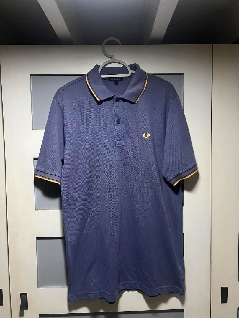Fred Perry Polo (Category: Tshirts & Polo Shirts ) located in Mandaluyong City. Submitted by santideclutters (Listing ID 1469523897, Image 1). Description: size: 28L 20W (L) color rate: 8.5/10 condition: 9/10 needs washing COLOR MAY VARY DUE TO LIGHTING.