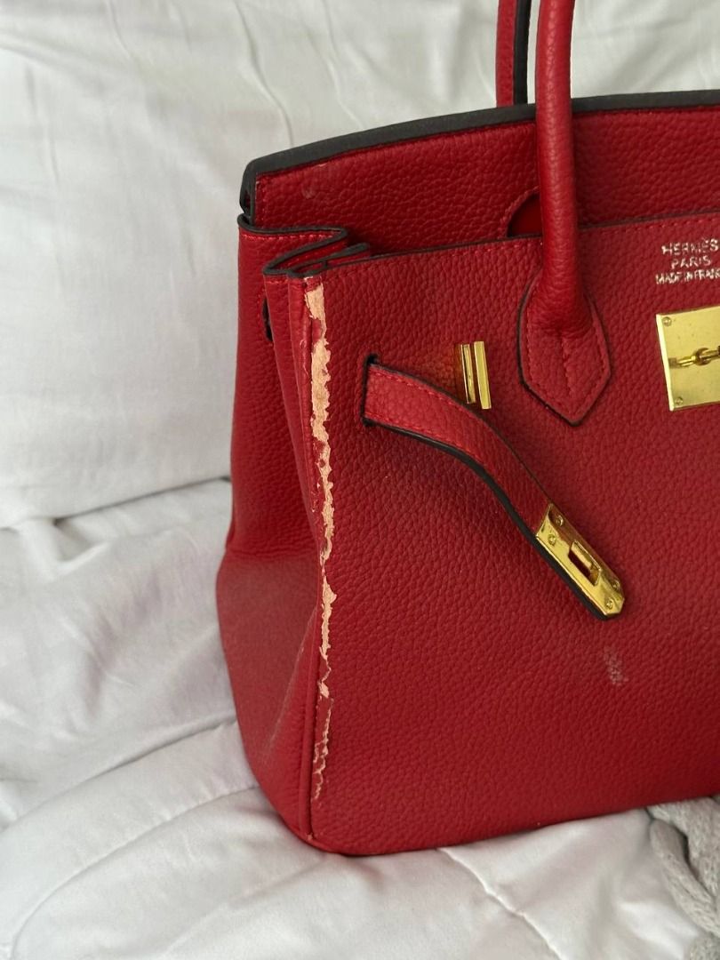 FREE birkin (Category: Luxury Bags & Wallets) located in Quezon City. Submitted by flipandfind (Listing ID 1469417934, Image 2). Description: - Brand: Hermès (NGA) - Style: Birkin Handbag - Material: Red textured leather (FAUX AND PEELING) - Hardware: Gold-tone - Features: Double top handles, front strap closure, matching red leather interior - Condition: Noticeable peeling and edge wear along the side gusset seam, with slight scuffs on the front