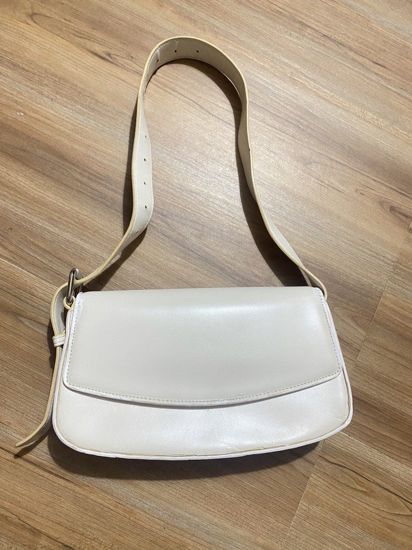FREE‼️when u buy anything (Category: Shoulder Bags) located in Bulacan. Submitted by Spothings (Listing ID 1469409701, Image 1). Description: - Color & Style: Structured white bag with trendy yellow contrast edging - Closure: Secure flap with magnetic snap - Storage: Built-in card holder slots and inside slip pocket - Exterior: Handy back slip pocket for quick access - Strap: Adjustable buckle strap with multiple length settings - Condition: Clea