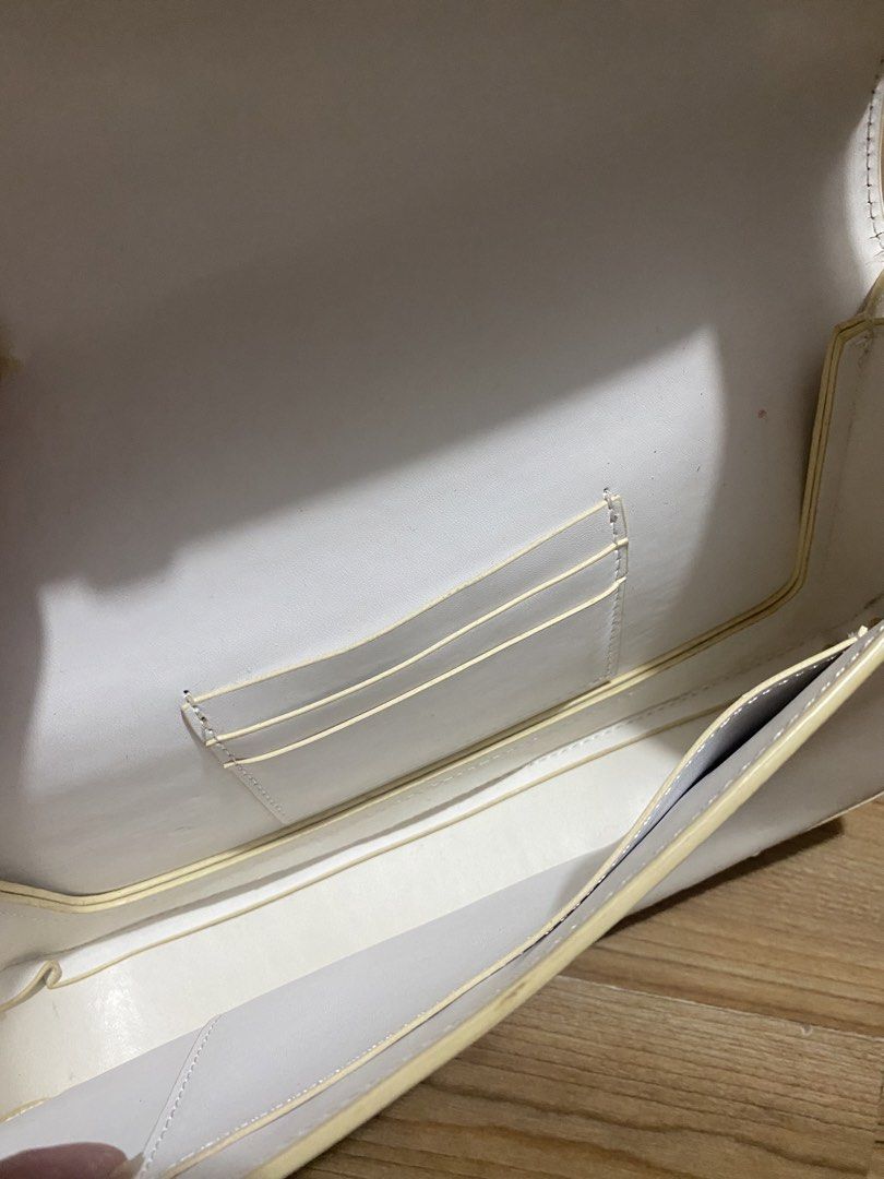 FREE‼️when u buy anything (Category: Shoulder Bags) located in Bulacan. Submitted by Spothings (Listing ID 1469409701, Image 2). Description: - Color & Style: Structured white bag with trendy yellow contrast edging - Closure: Secure flap with magnetic snap - Storage: Built-in card holder slots and inside slip pocket - Exterior: Handy back slip pocket for quick access - Strap: Adjustable buckle strap with multiple length settings - Condition: Clea