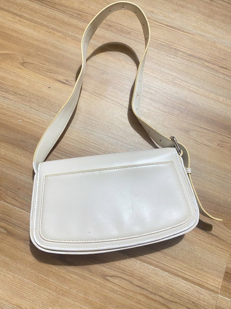 FREE‼️when u buy anything (Category: Shoulder Bags) located in Bulacan. Submitted by Spothings (Listing ID 1469409701, Image 3). Description: - Color & Style: Structured white bag with trendy yellow contrast edging - Closure: Secure flap with magnetic snap - Storage: Built-in card holder slots and inside slip pocket - Exterior: Handy back slip pocket for quick access - Strap: Adjustable buckle strap with multiple length settings - Condition: Clea
