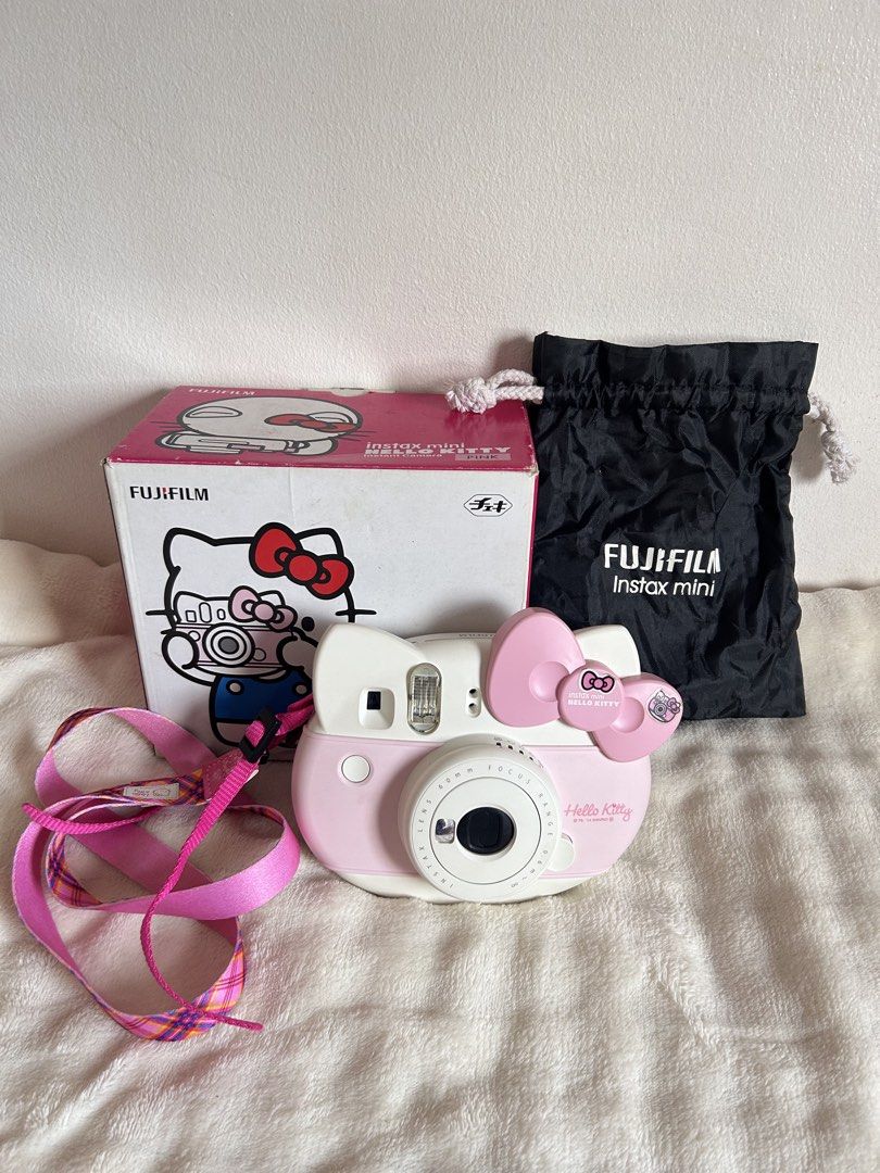 Fujifilm Instax Mini Hello Kitty Instant Camera Pink (Category: Cameras) located in Marikina City. Submitted by chayassy (Listing ID 1469453435, Image 1). Description: - Authentic Fujifilm Instax Mini Kitty instant camera (pink and white) - Shaped like Kitty with her signature pink bow - Tested and 100% fully functional - Clean battery compartment (batteries not included) - Inclusions: Original box, black drawstring pouch, pink plaid strap, user 