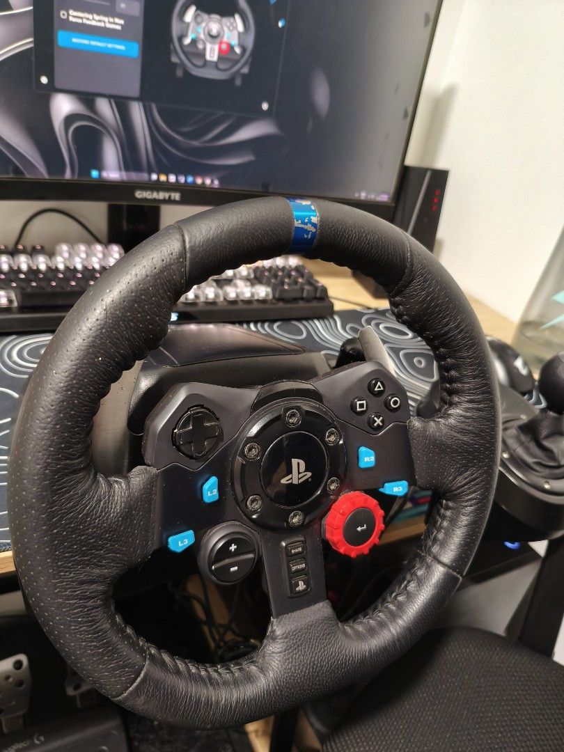 G29 Driving Force Racing Wheel (Category: Others) located in Dipolog. Submitted by mxrks (Listing ID 1469556901, Image 2). Description: Steering wheel with 900-degree rotation Dual-motor force feedback for realistic driving sensations Hand-stitched leather covering Stainless steel paddle shifters Separate 6-speed manual gear shifter with reverse gear (sold separately) Three-pedal unit: accelerator, brake, and clutch Nonlinear brake pedal for real