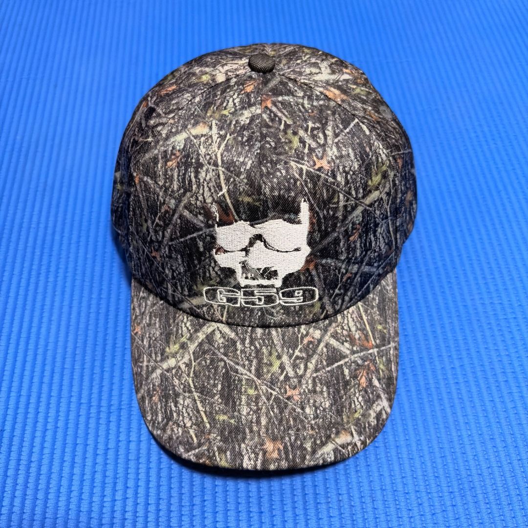 G59 Records Camo Logo Hat - Suicide Boys (Category: Caps & Hats) located in Rizal. Submitted by sensorix___ (Listing ID 1469433716, Image 1). Description: G59 Records Camo Logo Hat - Suicide Boys featuring a Realtree-style camouflage pattern with the white G59 skull logo and text embroidered on the front. CONDITION - LIKE NEW COLOR RATE - 10 OUT OF 10 OSFA - One Size Fits all .
