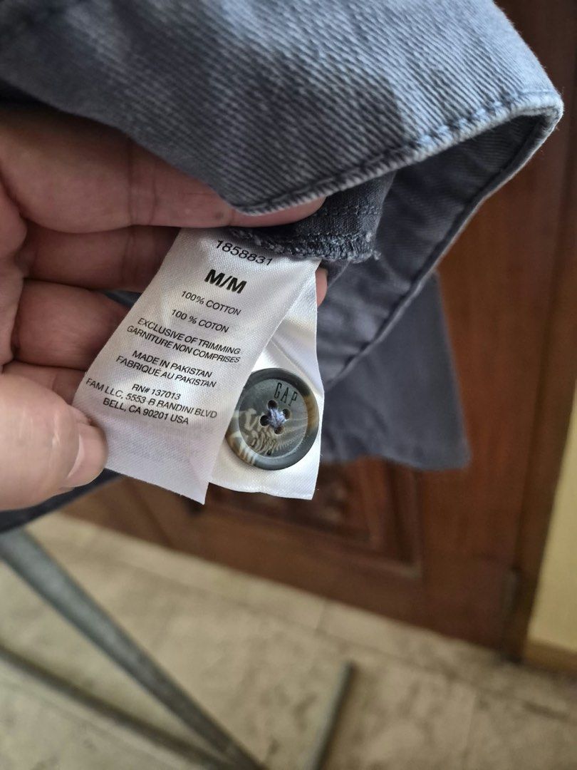 GAP Gray Cotton Button-Up Jacket Size M (Category: Coats, Jackets and Outerwear) located in Manila. Submitted by freestone_f18729 (Listing ID 1469421631, Image 3). Description: - Brand: GAP - Size: M - Material: 100% Cotton - Color: Solid charcoal gray - Features: Button-up front with branded buttons, collared neckline with hanging loop, two front chest patch pockets - Condition: Great staple piece for casual wear - Origin: Made in Pakistan Never