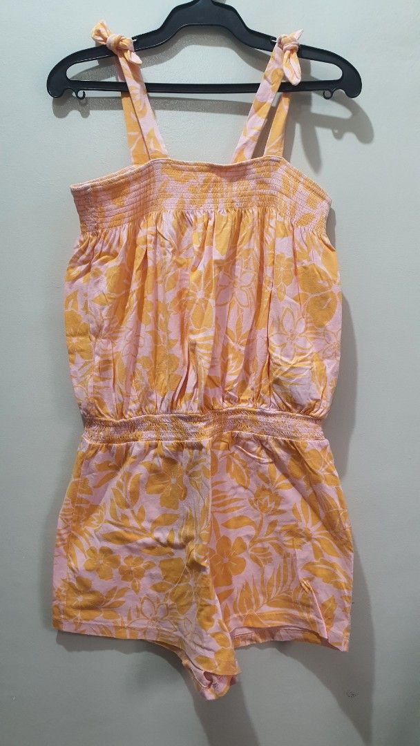 Gap Kids Floral Romper Size XL (Category: Babies & Kids Fashion) located in Santa Rosa. Submitted by regcruz (Listing ID 1469404486, Image 1). Description: - Brand: Gap Kids - Design: Light pink and yellow with all-over tropical flower print - Features: Cute tie straps at the shoulders - Fit: Smocked bodice and waist for easy stretch and comfort - Style: Casual and breezy piece, perfect for warm days.