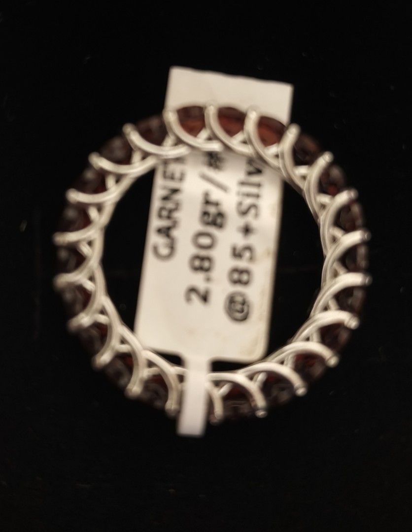 Garnet Silver Full Eternity Ring Size 6 (Category: Rings) located in Batangas. Submitted by decluttering_bliss (Listing ID 1469512878, Image 2). Description: - Stunning garnet eternity ring set in 925 silver - Size: 6.5 - Total weight: 2.80 grams - Design: Vibrant red round stones all around with intricate interwoven silver metalwork - Condition: Brand new with original store tag attached - Perfect for stacking or wearing on its own.
