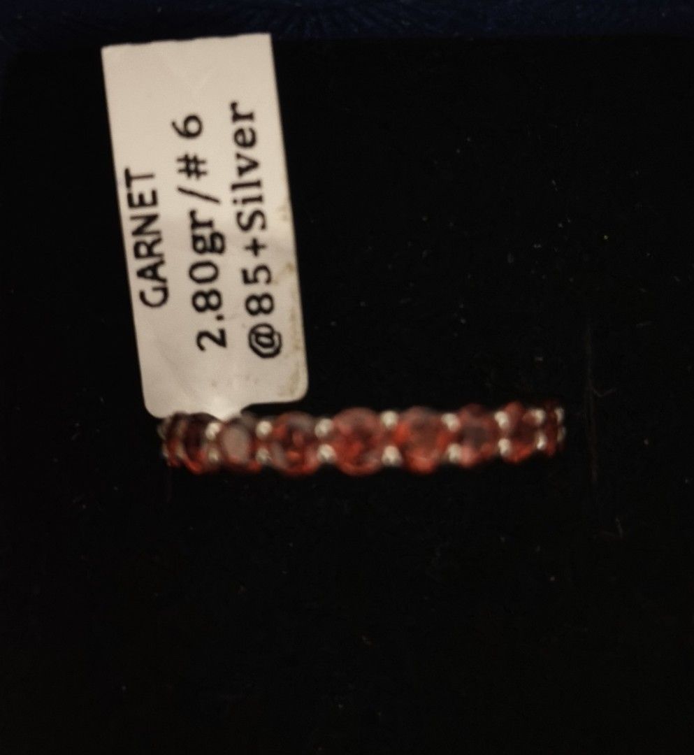 Garnet Silver Full Eternity Ring Size 6 (Category: Rings) located in Batangas. Submitted by decluttering_bliss (Listing ID 1469512878, Image 1). Description: - Stunning garnet eternity ring set in 925 silver - Size: 6.5 - Total weight: 2.80 grams - Design: Vibrant red round stones all around with intricate interwoven silver metalwork - Condition: Brand new with original store tag attached - Perfect for stacking or wearing on its own.