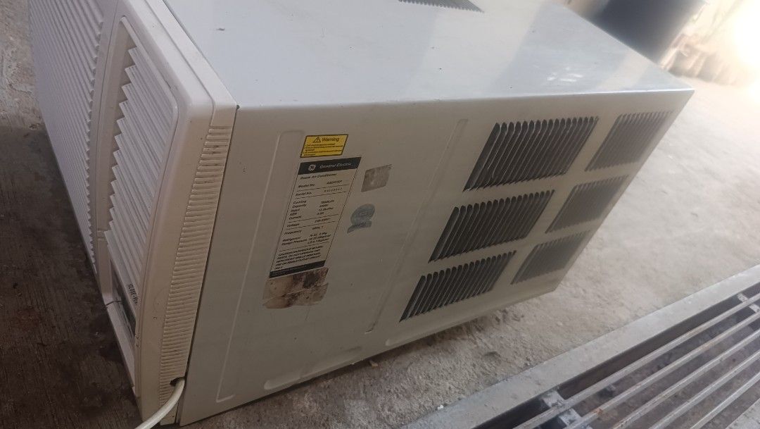 GE Profile Room Air Conditioner AED07KP (Category: Air Conditioning and Heating) located in Antipolo. Submitted by joshuaduites34q (Listing ID 1469430861, Image 2). Description: - Brand/Model: GE Profile Window Type AC (AED07KP) - Cooling Capacity: 7880 kJ/h (630W, 220-230V standard plug) - Condition: Heavy-duty, works perfectly with clean back coils; minor exterior wear from previous installation - Features: Digital control panel, white casing w