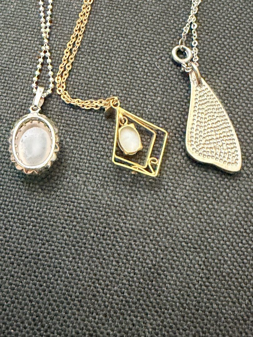 Gemstone necklace (Category: Necklaces) located in Pasig City. Submitted by smartshopping.ph (Listing ID 1469499440, Image 2). Description: Beautiful trio of necklaces showcases a blend of vintage and organic styles: 1. Rose Quartz Scalloped Pendant 2. Art Deco Geometric Pendant with small, rounded white opal cabochon. 3. Asymmetric Pāua / Abalone Shell pendant. A freeform, teardrop-shaped New Zealand pāua (abalone) shell. Price: 500 php each.