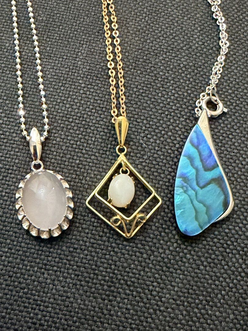 Gemstone necklace (Category: Necklaces) located in Pasig City. Submitted by smartshopping.ph (Listing ID 1469499440, Image 1). Description: Beautiful trio of necklaces showcases a blend of vintage and organic styles: 1. Rose Quartz Scalloped Pendant 2. Art Deco Geometric Pendant with small, rounded white opal cabochon. 3. Asymmetric Pāua / Abalone Shell pendant. A freeform, teardrop-shaped New Zealand pāua (abalone) shell. Price: 500 php each.