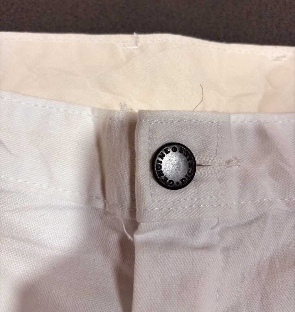 Genuine Dickies White Carpenter Pants (Category: Jeans) located in Mabalacat. Submitted by _limitlessfashion (Listing ID 1469425238, Image 2). Description: - Brand: Genuine Dickies - Color: Classic White - Size 34-35 - Length 42 - Hem 9.5 - No issue, need wash only - Material: Heavy-duty, durable cotton blend - Fit: Relaxed fit for all-day comfort - Features: Multiple side utility pockets, hammer loop, branded black metal button closure, and wove