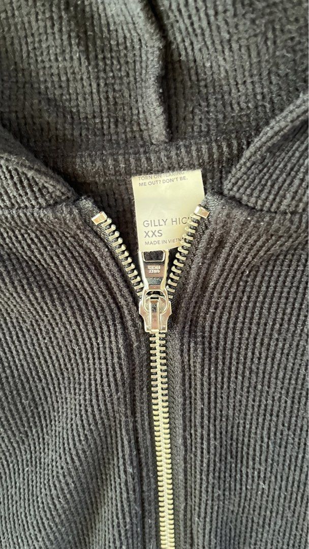 Gilly Hicks Black Waffle Knit Romper XXS (Category: Rompers) located in Taguig. Submitted by bbbgggrr (Listing ID 1469492564, Image 2). Description: - Brand: Gilly Hicks - Item: Waffle knit romper - Size: XXS - Color: Black - Features: Long sleeves, attached hood, quarter-zip front, elastic waistband with adjustable drawstrings - Material: Super cozy textured fabric - Origin: Made in Vietnam.