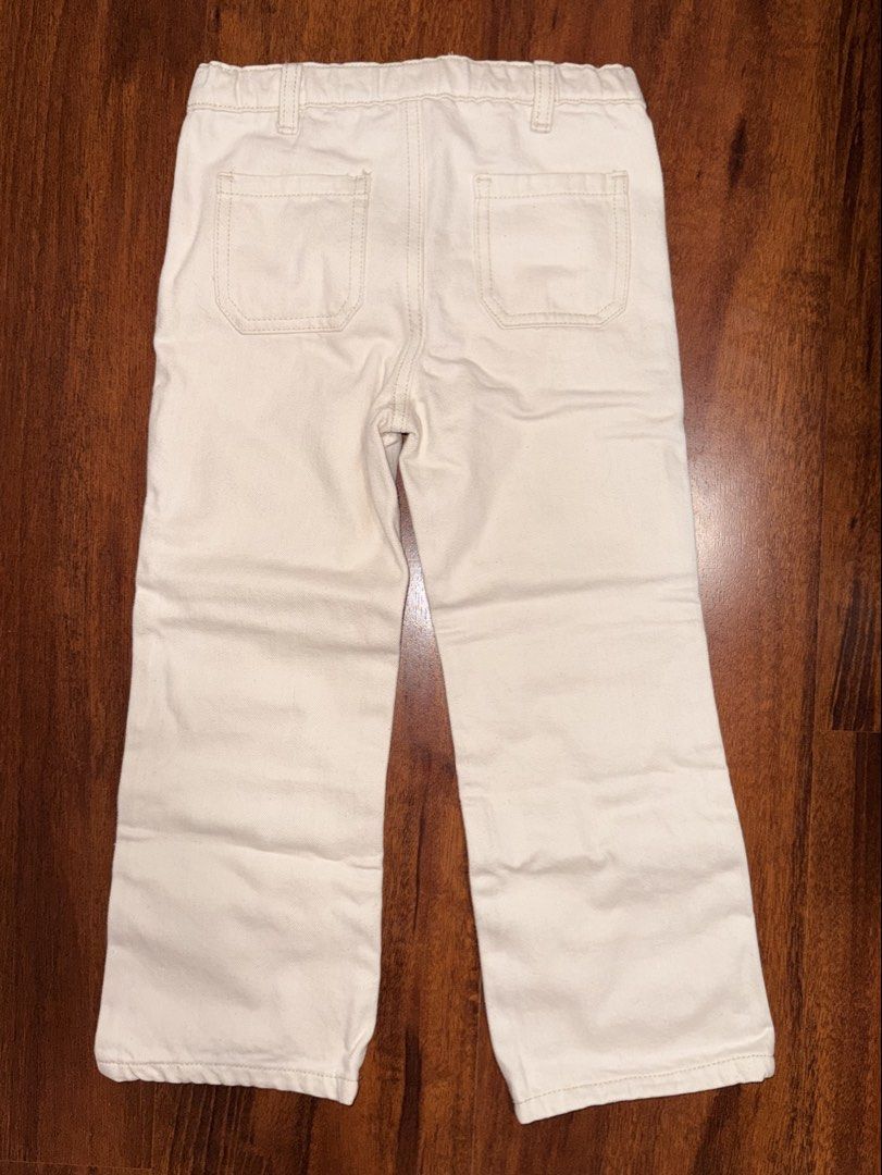 Gingersnaps Embroidered Parrot Banana Pants (Category: Babies & Kids Fashion) located in Cabanatuan. Submitted by baju101 (Listing ID 1469505501, Image 2). Description: - Brand: Gingersnaps - Size: 4 (Tag) (may fit 3y/o) - Color: Off-white denim - Design: Cute tropical embroidery with a parrot on the right leg and bananas on the left - Features: Zip fly with button closure, belt loops, and back patch pockets - Measurements: Waist 26 cm across, To