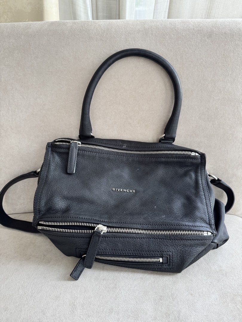 Givenchy Pandora Medium Bag Black Goat Leather (Category: Luxury Bags & Wallets) located in Paranaque City. Submitted by piemumbuys (Listing ID 1469464484, Image 1). Description: - Brand: Givenchy Pandora Medium - Material: 100% Black goat leather (verified by original store tag) - Hardware: Silver-tone - Features: Top handle, detachable shoulder strap, multiple zipped compartments, clean interior lining - Origin: Made in Italy - Condition: Soft 