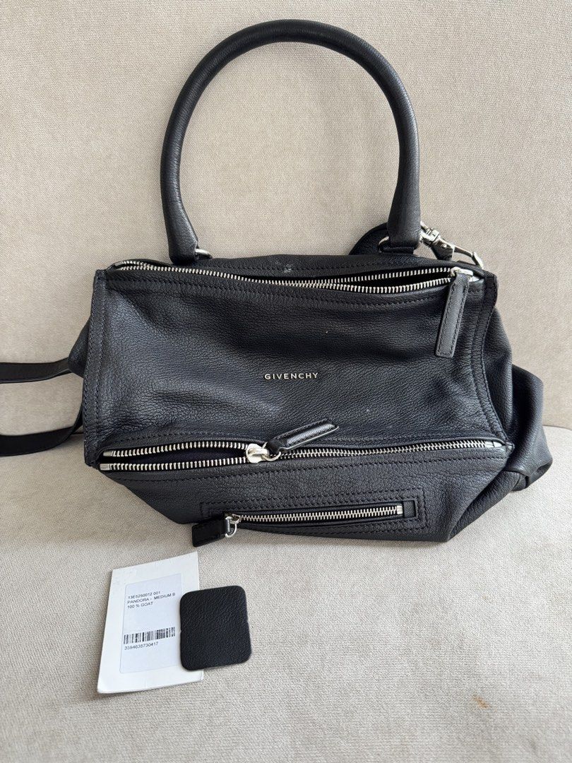 Givenchy Pandora Medium Bag Black Goat Leather (Category: Luxury Bags & Wallets) located in Paranaque City. Submitted by piemumbuys (Listing ID 1469464484, Image 2). Description: - Brand: Givenchy Pandora Medium - Material: 100% Black goat leather (verified by original store tag) - Hardware: Silver-tone - Features: Top handle, detachable shoulder strap, multiple zipped compartments, clean interior lining - Origin: Made in Italy - Condition: Soft 