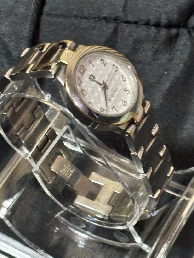 Givenchy Quartz Watch Silver Tone Textured Dial Stainless Steel Back (Category: Women's Watches) located in Caloocan City. Submitted by berndale_closet (Listing ID 1469570539, Image 2). Description: - Authentic Givenchy quartz wrist watch - Silver-tone metal strap with branded logo clasp - Stylish textured checkered dial with numbered face - Stainless steel back, water resistant (5ATM), Swiss parts - Battery operated and fully functional - Condit