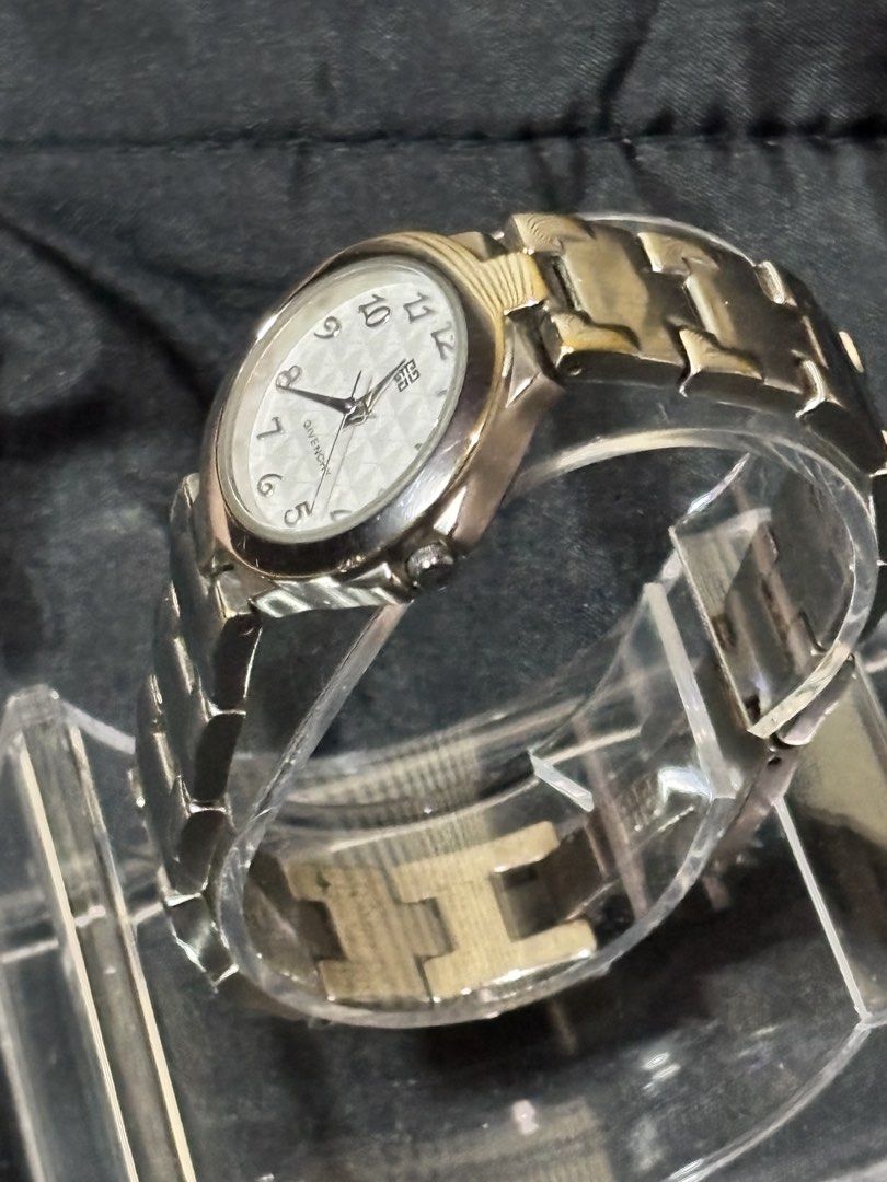 Givenchy Quartz Watch Silver Tone Textured Dial Stainless Steel Back (Category: Women's Watches) located in Caloocan City. Submitted by berndale_closet (Listing ID 1469570539, Image 3). Description: - Authentic Givenchy quartz wrist watch - Silver-tone metal strap with branded logo clasp - Stylish textured checkered dial with numbered face - Stainless steel back, water resistant (5ATM), Swiss parts - Battery operated and fully functional - Condit