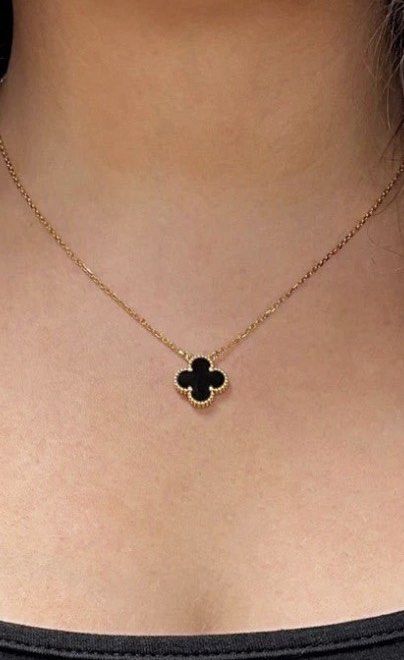 Gold Four-Leaf Clover Black Pendant Necklace (Category: Necklaces) located in San Juan City. Submitted by hellokitty_454 (Listing ID 1469462294, Image 1). Description: - Elegant gold chain necklace with a black four-leaf clover pendant - Features a delicate beaded trim around the clover motif - Secured with a simple lobster clasp and extension links - Sits gracefully right on the collarbone - Perfect, versatile piece for daily wear - with box.