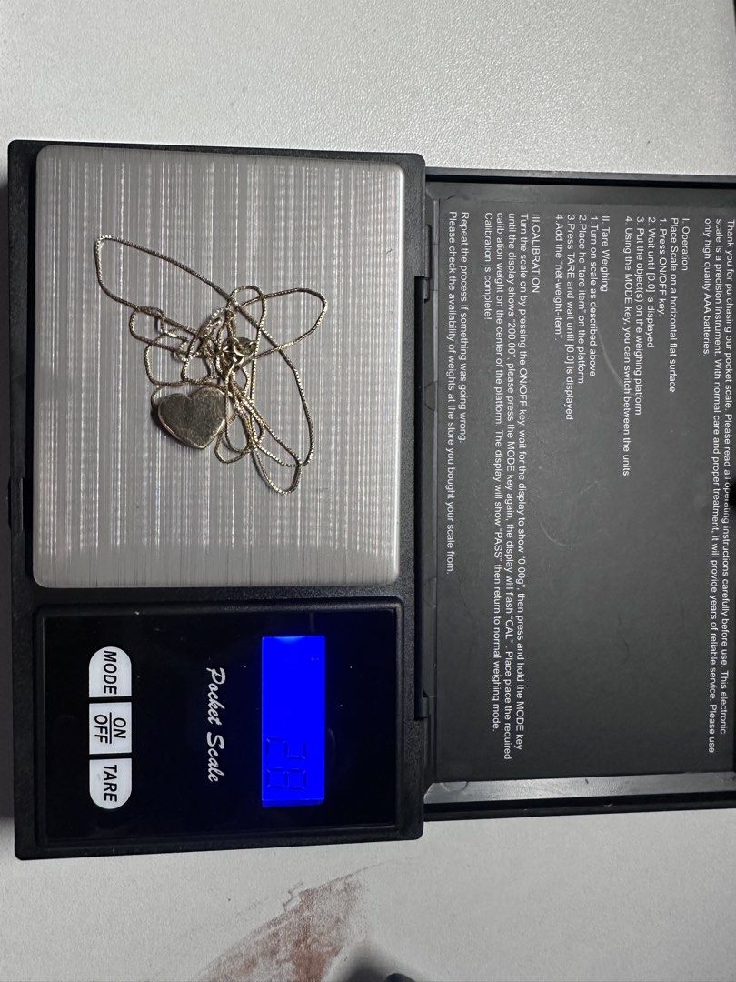 Gold Heart Pendant Necklace (Category: Necklaces) located in Manila. Submitted by aouievallente (Listing ID 1469417929, Image 2). Description: - Material/Design: 18K Gold chain necklace with a solid heart pendant - Chain Style: Delicate box chain with a secure clasp closure - Weight: Approx. 2.8 grams - Condition: with noticeable scratches no tarnishing - Styling: Perfect for everyday wear or easy layering.