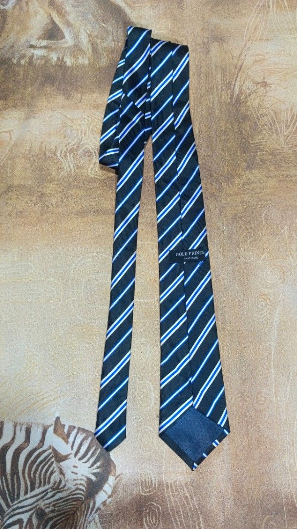 Gold Prince Hand Made Striped Tie (Category: Ties) located in Cavite. Submitted by navias (Listing ID 1469396238, Image 1). Description: Origin:UAE100% - Brand: Gold Prince (Handmade) - Design: Classic black base with diagonal white and blue stripes - Details: Clean stitching and clear brand label on the back loop - Fit: Standard width style - Styling: Easy to match with formal shirts and business suits Transaction Details: -via immediate same-da