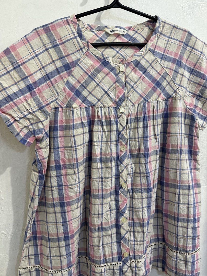 goodday plaid short sleeve button up blouse size 160 (Category: Blouses) located in San Jose del Monte. Submitted by bizzybeebyhgc (Listing ID 1469432959, Image 3). Description: - Brand: Goodday - Color/Pattern: Cream base with pink & blue plaid - Features: Button-up front, round neckline, gathered yoke panel - Detail: Delicate lace trim along the bottom hem - Material: Soft and lightweight.