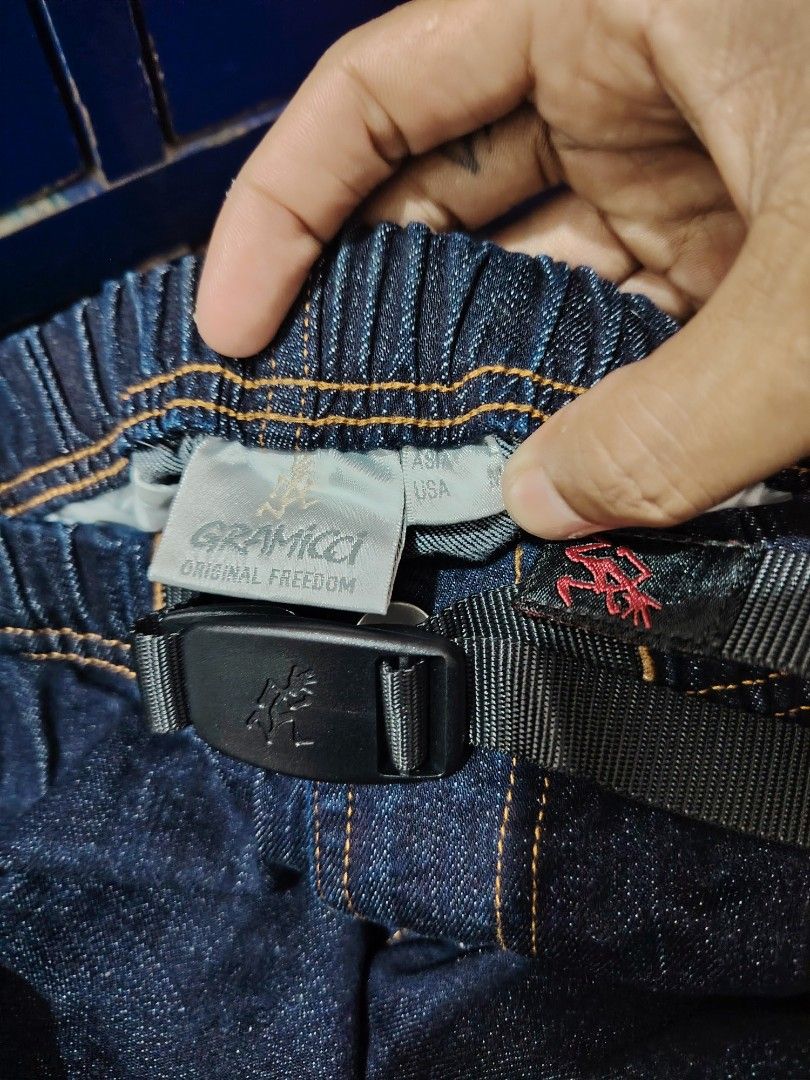 Gramicci Denim Pants Jeans (Category: Jeans) located in Roxas, Palawan. Submitted by act_thrift_palawan (Listing ID 1469396011, Image 3). Description: - Brand: Gramicci - Style: Denim pants / Model G112-OGSD - Color: Dark blue wash - Waist: Elastic waistband with built-in adjustable belt and iconic running man logo - Details: Back pocket with Gramicci brand label - Material: 99% Cotton, 1% Polyurethane (slight stretch for comfort) - Origin: Made 
