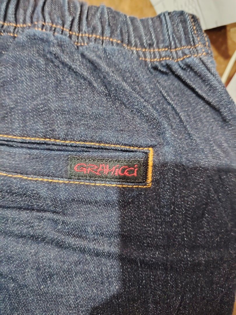Gramicci Denim Pants Jeans (Category: Jeans) located in Roxas, Palawan. Submitted by act_thrift_palawan (Listing ID 1469396011, Image 2). Description: - Brand: Gramicci - Style: Denim pants / Model G112-OGSD - Color: Dark blue wash - Waist: Elastic waistband with built-in adjustable belt and iconic running man logo - Details: Back pocket with Gramicci brand label - Material: 99% Cotton, 1% Polyurethane (slight stretch for comfort) - Origin: Made 