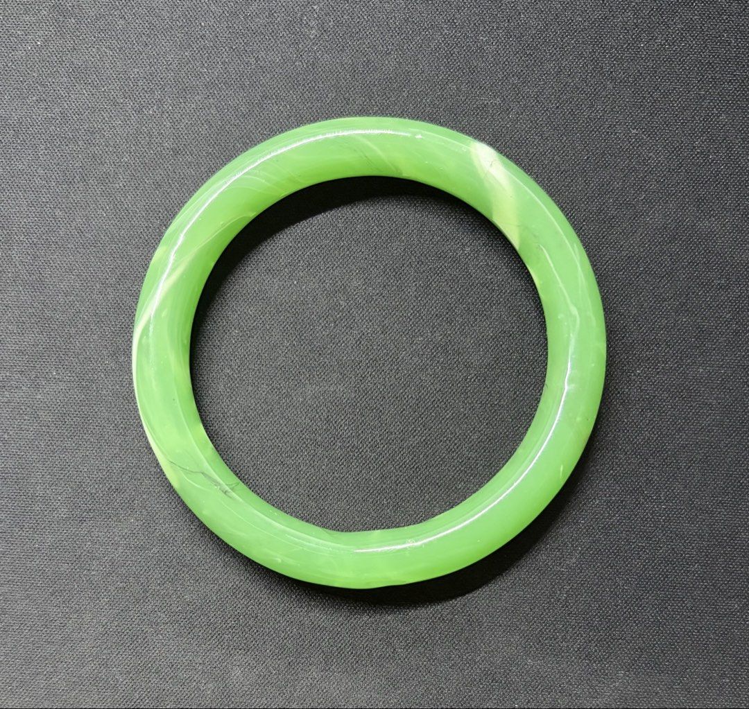 Green Jade Bangle Bracelet (Category: Bracelets) located in Quezon City. Submitted by garagesale2026 (Listing ID 1469554220, Image 1). Description: - Vibrant green jade with natural white marbling and cloud patterns - Smooth polished finish with a high-gloss shine - Inner diameter: approximately 60mm - From Hong Kong.