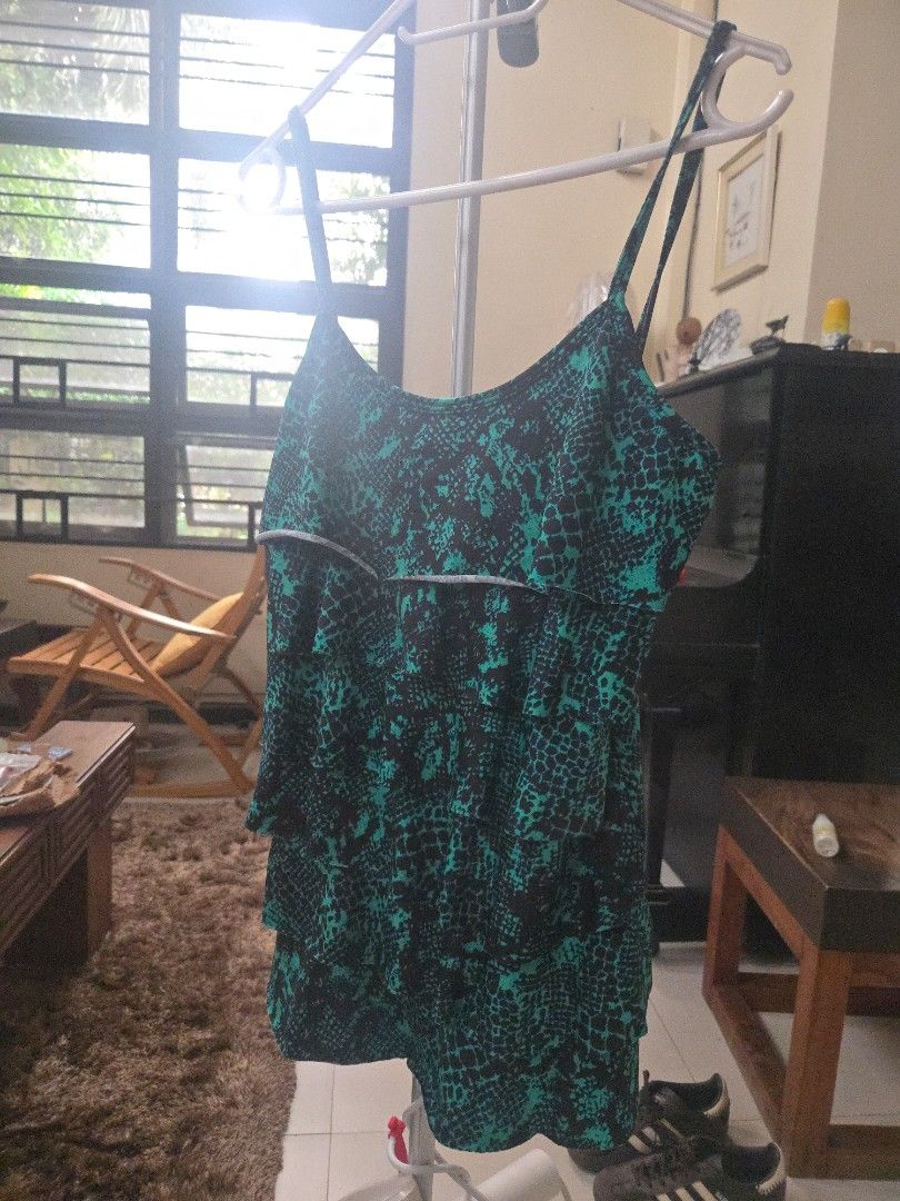 green ruffle top (Category: Blouses) located in Manila. Submitted by thewalkingmuse (Listing ID 1469428525, Image 1). Description: brand new without tag. never been used. no flaws.