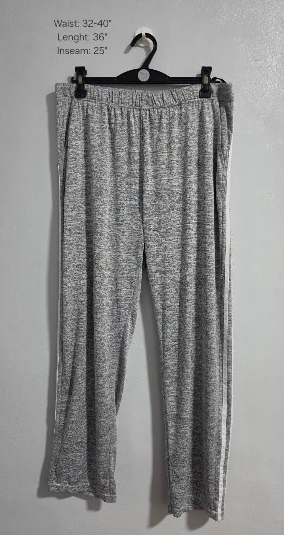 Grey Heather Joggers Sweatpants with White Side Stripes (Category: Other Bottoms) located in Paranaque City. Submitted by franinnashop (Listing ID 1469453177, Image 1). Description: Declutter - Color/Pattern: Grey heather with contrasting white side stripes - Fit: Relaxed fit with a comfortable, stretchy elastic waistband - Features: Convenient side pockets - Best For: Lounging at home or running errands - Measurements: Waist 32-40 inches | Lengt